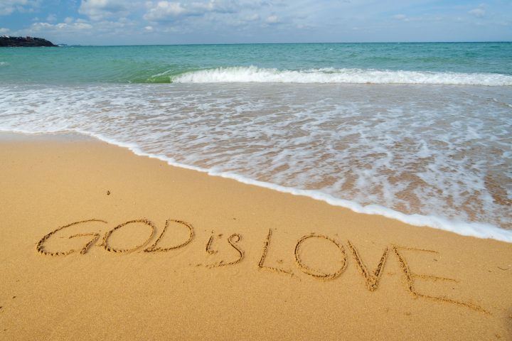 God is love on the sea shore.