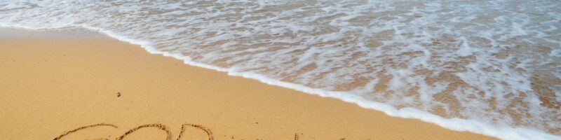 God is love on the sea shore.