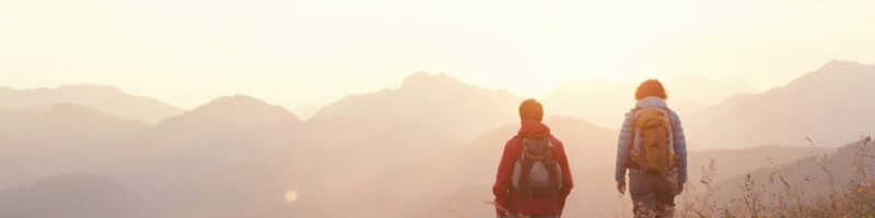 Austria, Tyrol, couple hiking at Unterberghorn at sunrise