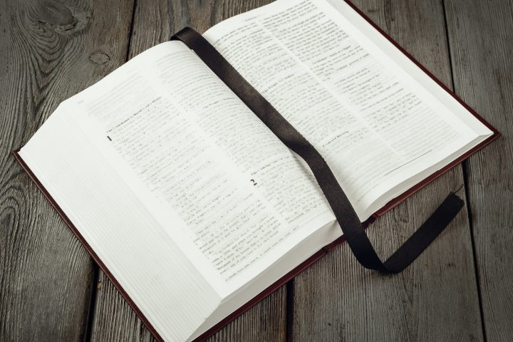 The Holy Bible on a wooden table