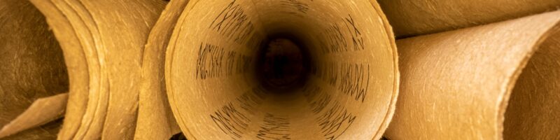 Old scribe library. Retro futhpak scrolls stacked on a pile.