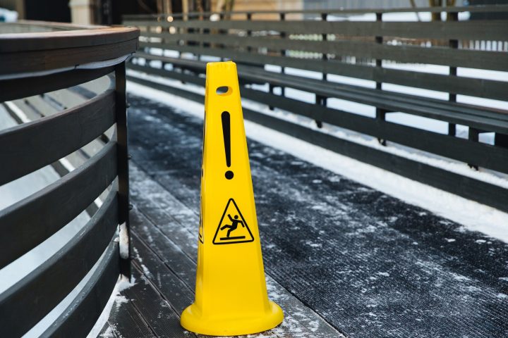 Be aware of slippery road. Slippery yellow surface sign. Wet floor sign. Icing concept
