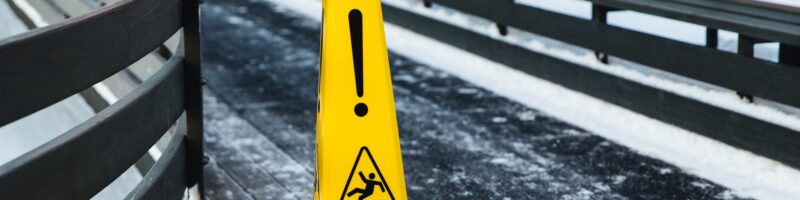 Be aware of slippery road. Slippery yellow surface sign. Wet floor sign. Icing concept