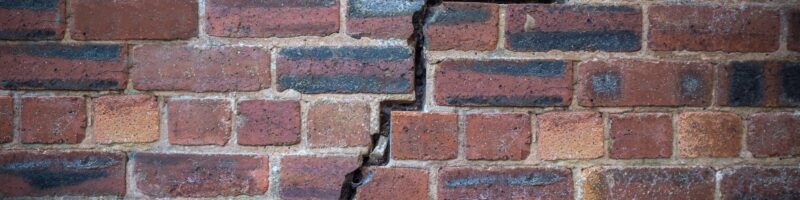 Cracked Red Brick Wall