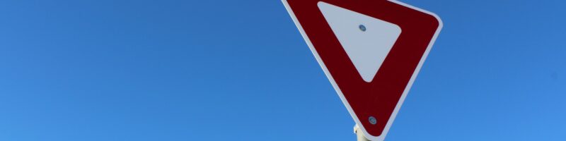 Yield Sign Against Blue Sky