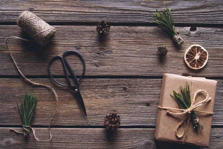 Hand made craft gifts of paper with ribbon at Christmas holiday and presents. On wooden background