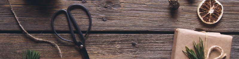 Hand made craft gifts of paper with ribbon at Christmas holiday and presents. On wooden background