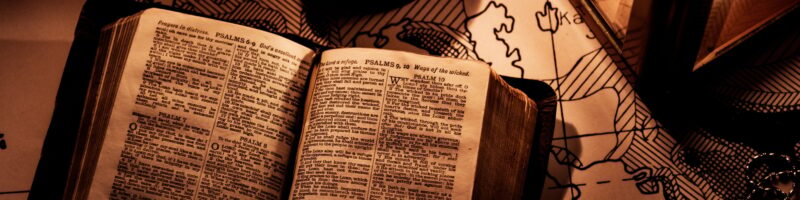 An old bible on a wooden table